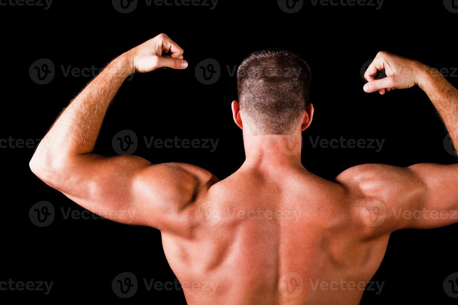 le dos du bodybuilder musclé photo