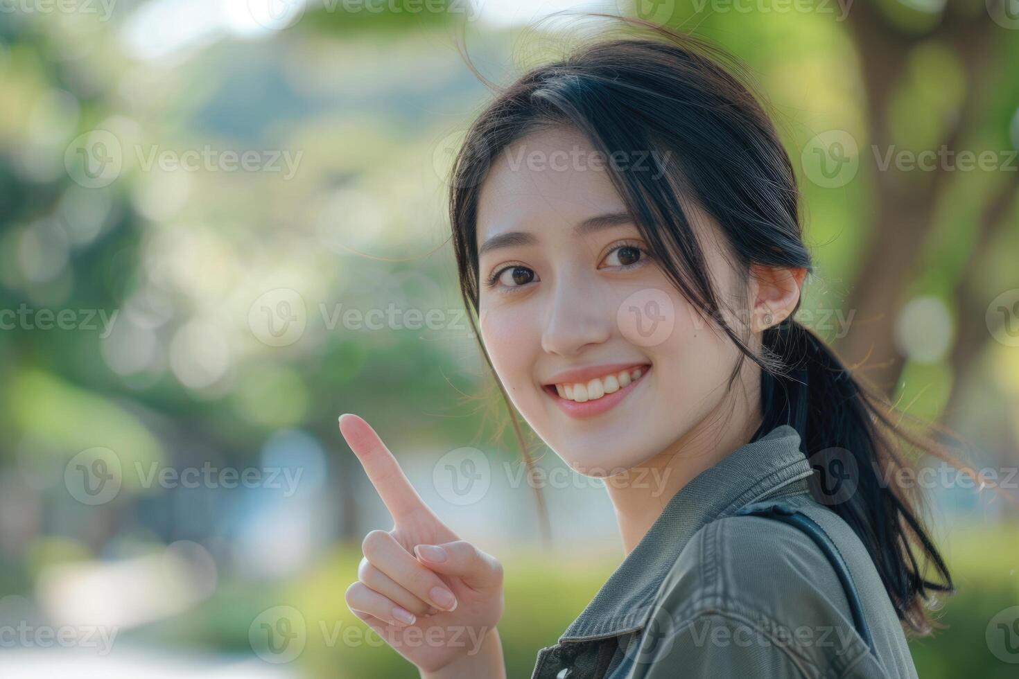 ai généré portrait de de bonne humeur Jeune asiatique femme montrer du doigt à copie espace photo