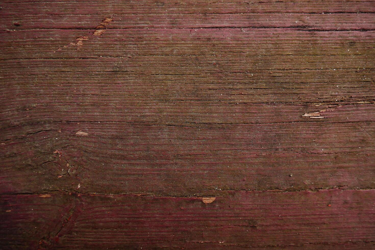 une proche en haut de une en bois mur avec une rouge peindre photo