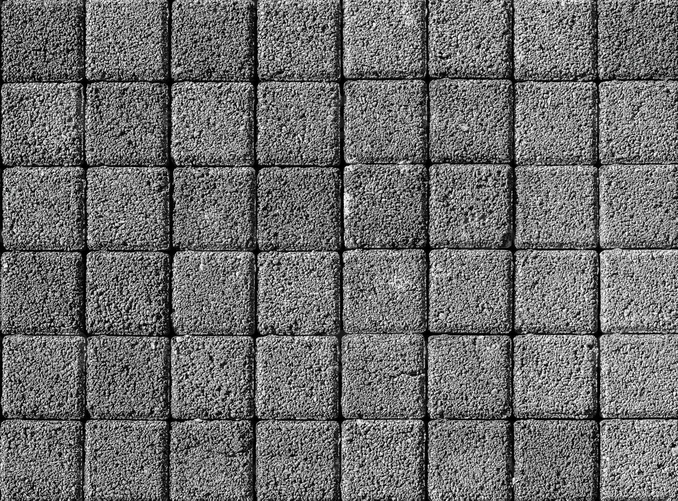 le texture de une pierre monotone chaussée. Haut voir. abstrait Contexte. photo