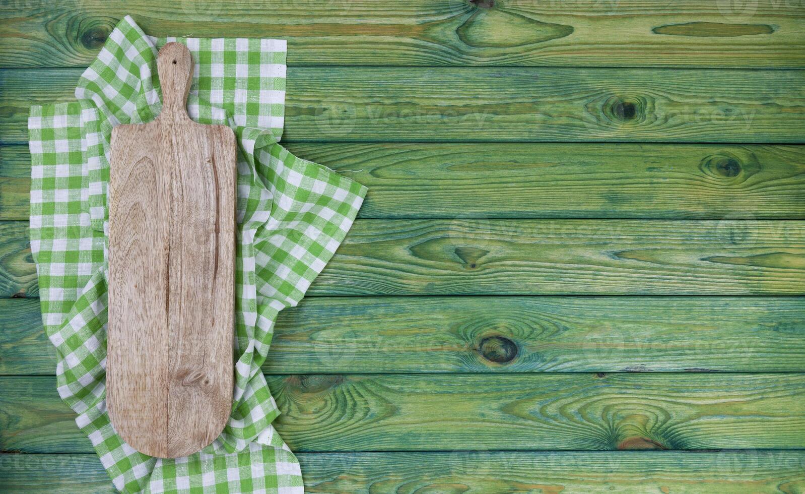 Coupe planche sur vert à carreaux nappe de table, Haut vue photo