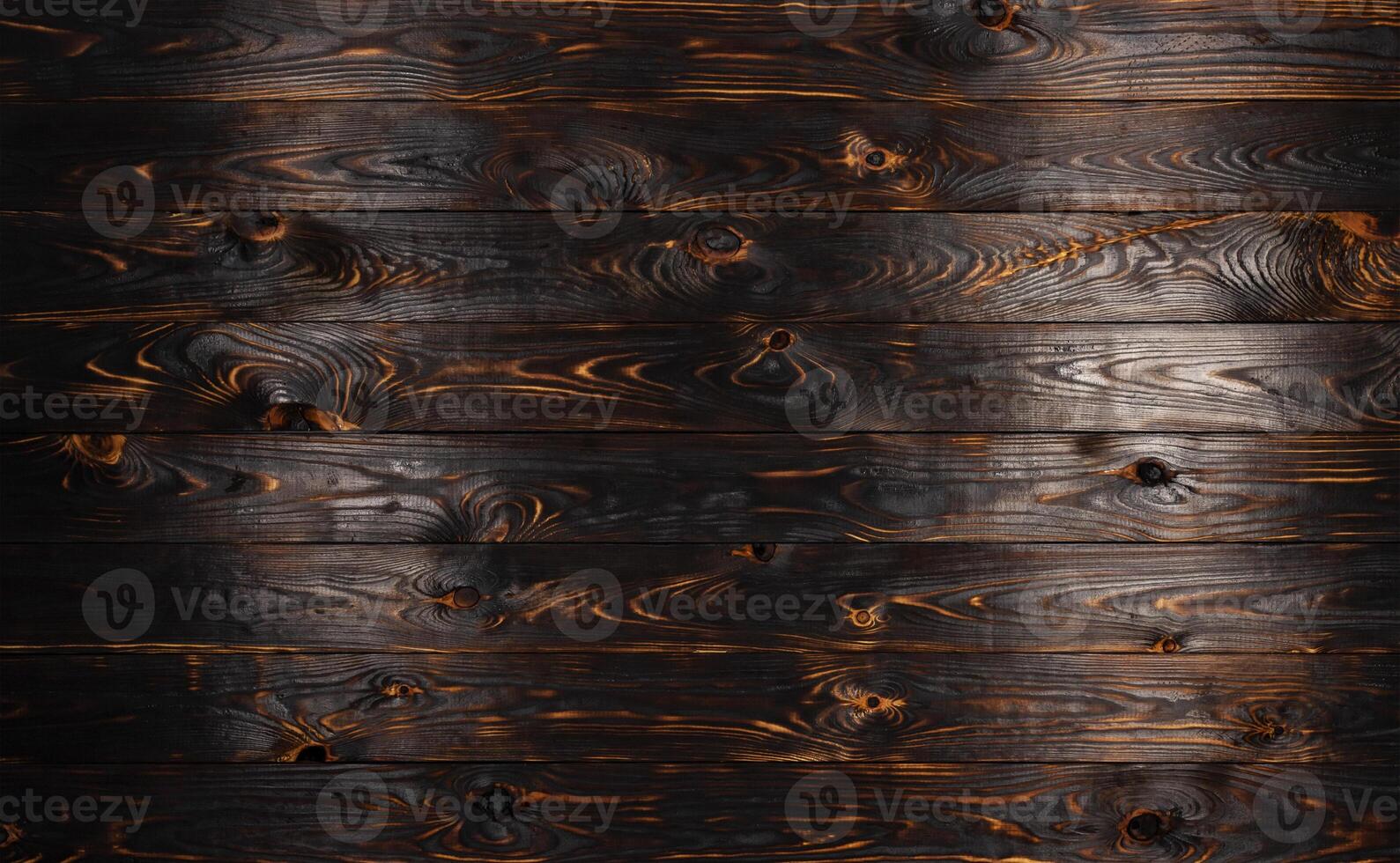 planche de bois brûlée, texture de bois de charbon de bois noir, fond de barbecue brûlé photo