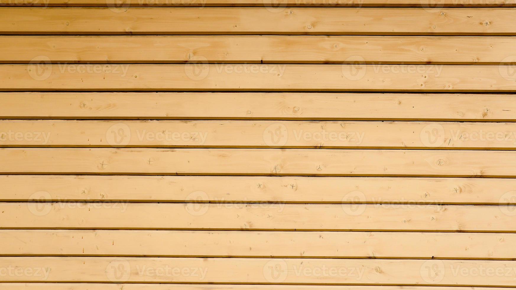 fond en bois vintage marron de planches. texture bois vieilli brun foncé avec motif rayé naturel pour le fond, surface en bois pour ajouter du texte de décoration ou des illustrations. photo