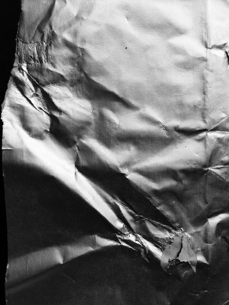 la surface de la texture du papier d'aluminium pour les matériaux d'arrière-plan et de conception. collection de texture froissée de feuille d'argent. abstrait froissé de fond. photo