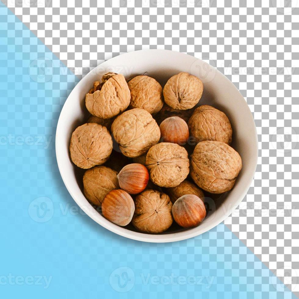 vue de dessus tas de noix sur bol blanc isolé avec fond transparent. photo