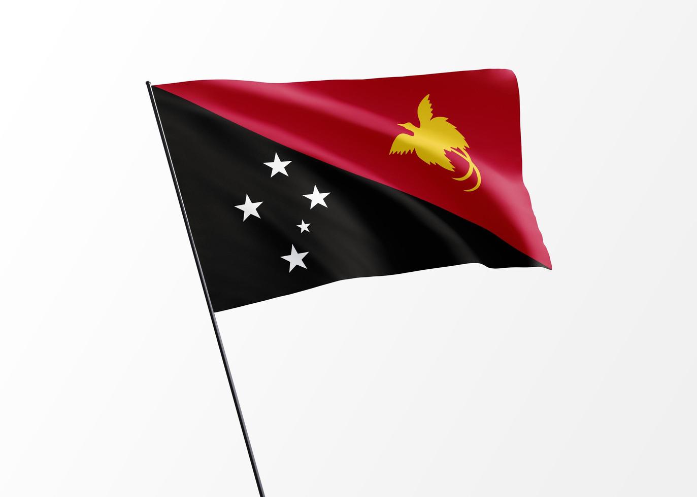 Drapeau de la papouasie-nouvelle-guinée volant haut dans le fond isolé fête de l'indépendance de la papouasie-nouvelle-guinée. collection de drapeaux nationaux du monde photo