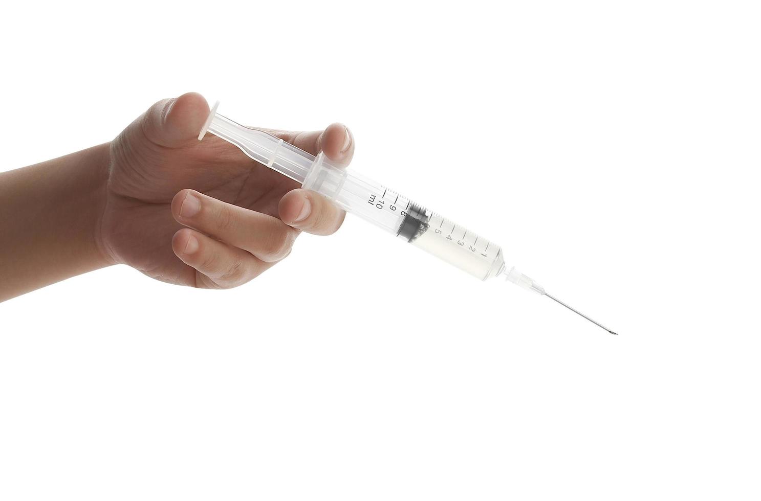 docteur tenant le vaccin covid-19 à la main sur fond blanc photo