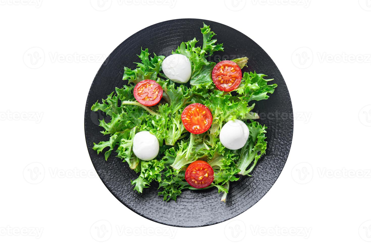salade mozzarella, tomate, laitue, roquette repas sain nourriture végétalienne ou végétarienne photo