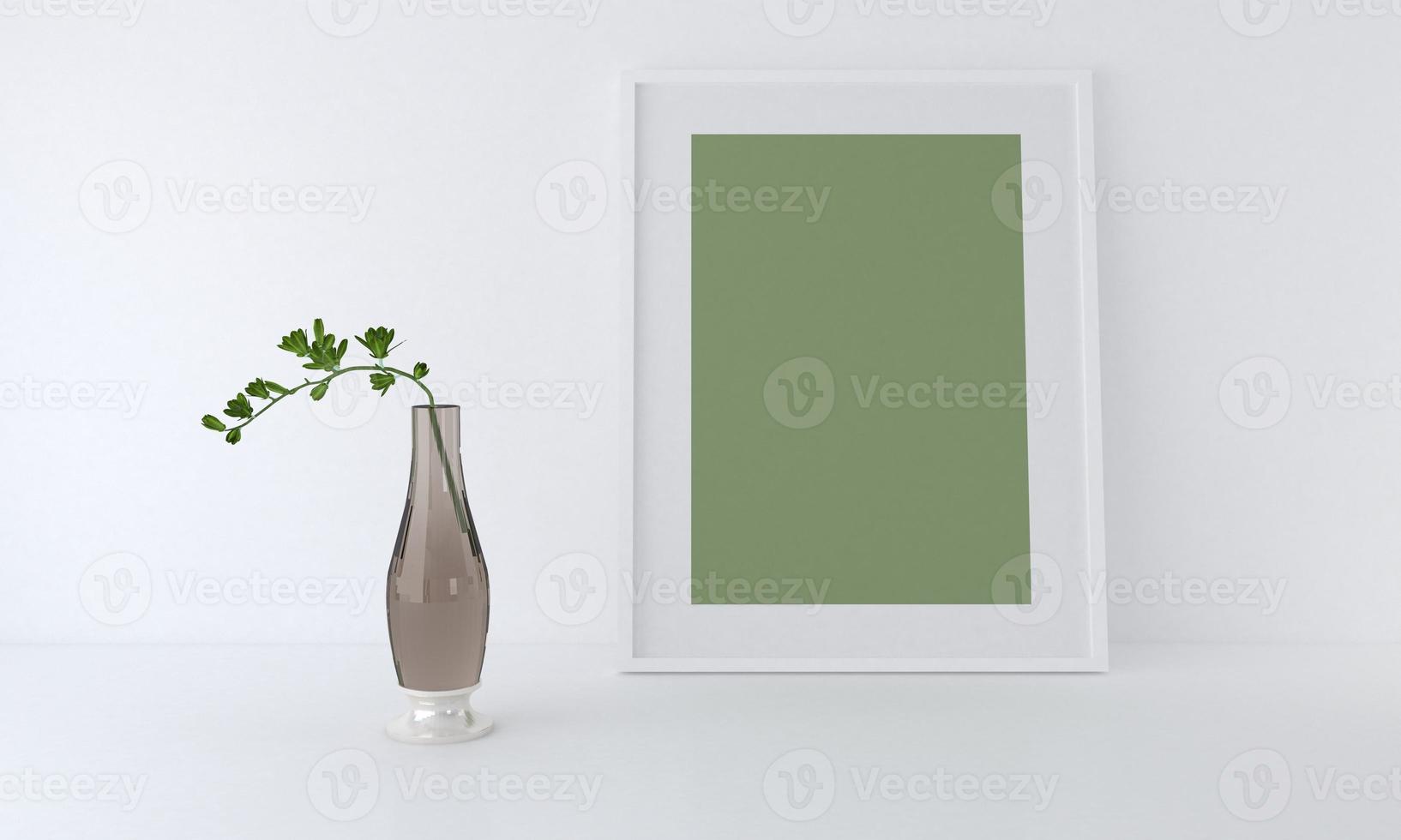 Rendu 3D d'une maquette de cadre vierge verte à côté d'un vase en verre appuyé contre un mur blanc photo