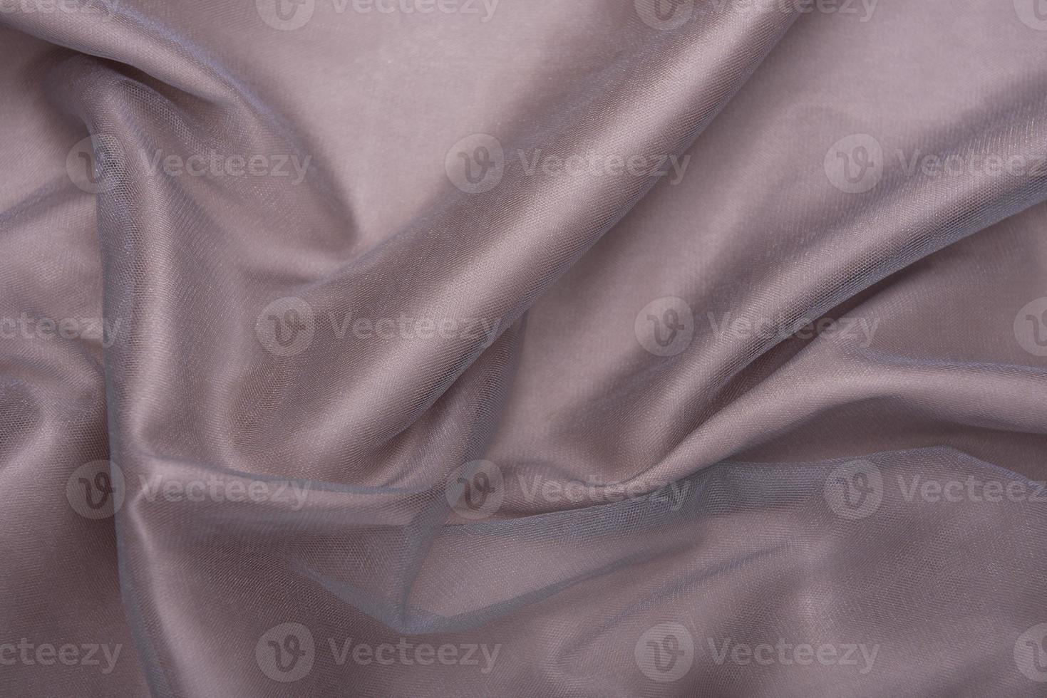 belle texture de tissu de tissu de luxe en satin de soie brun clair ondulé élégant lisse photo