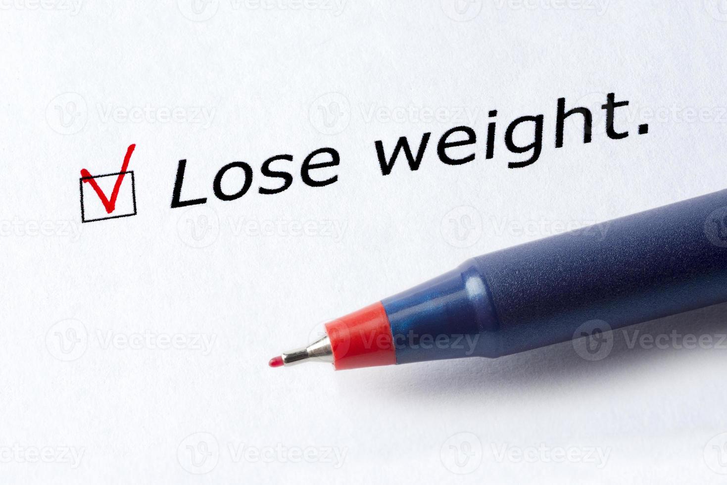 le mot perdre du poids est imprimé sur un fond blanc. photo