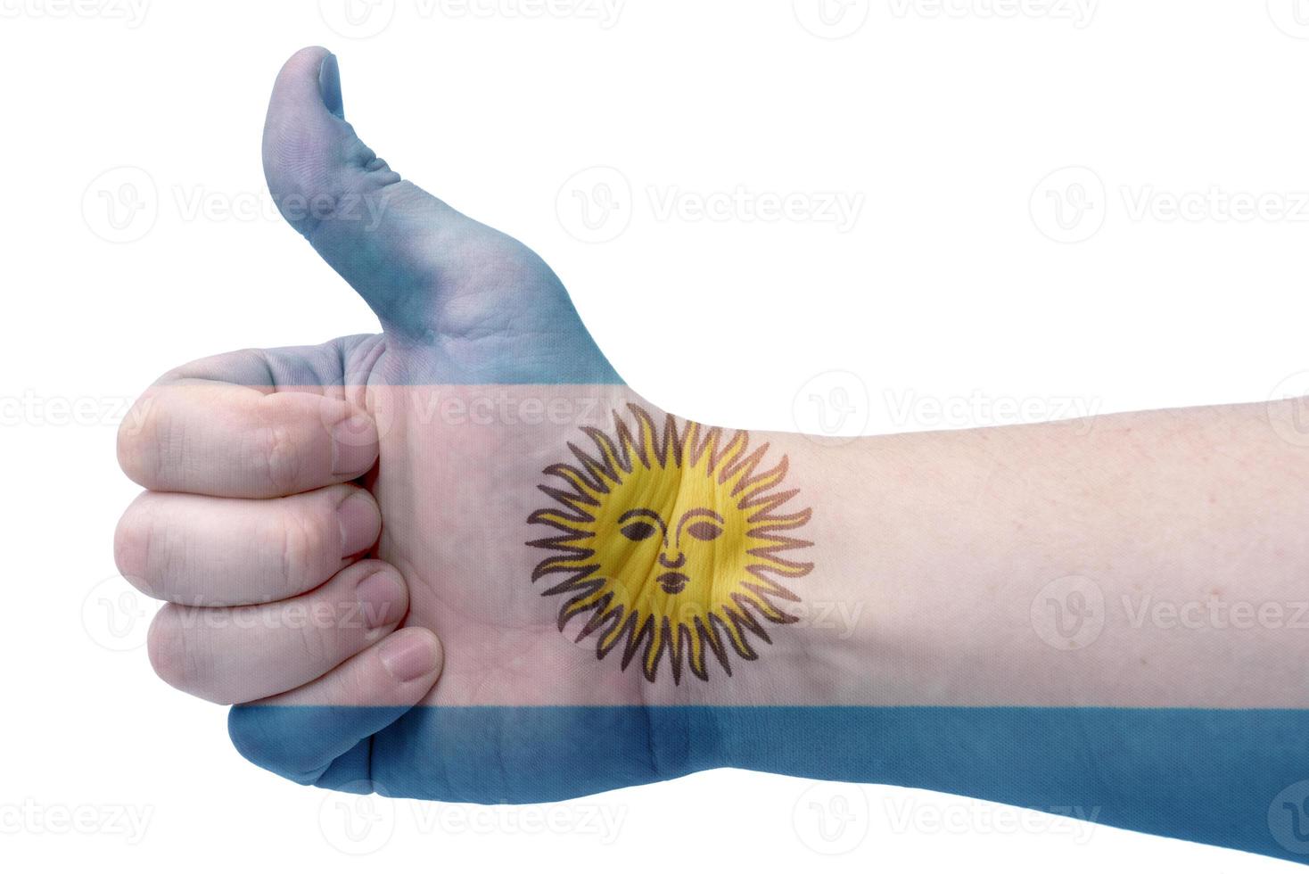 le concept de l'argentine-la main donne un coup de pouce avec le drapeau de l'argentine. photo