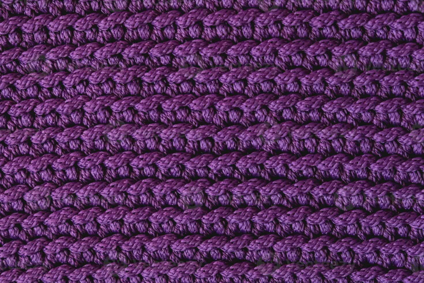 fond de texture de tissu tricoté violet. vue de dessus. copie, espace vide pour le texte photo