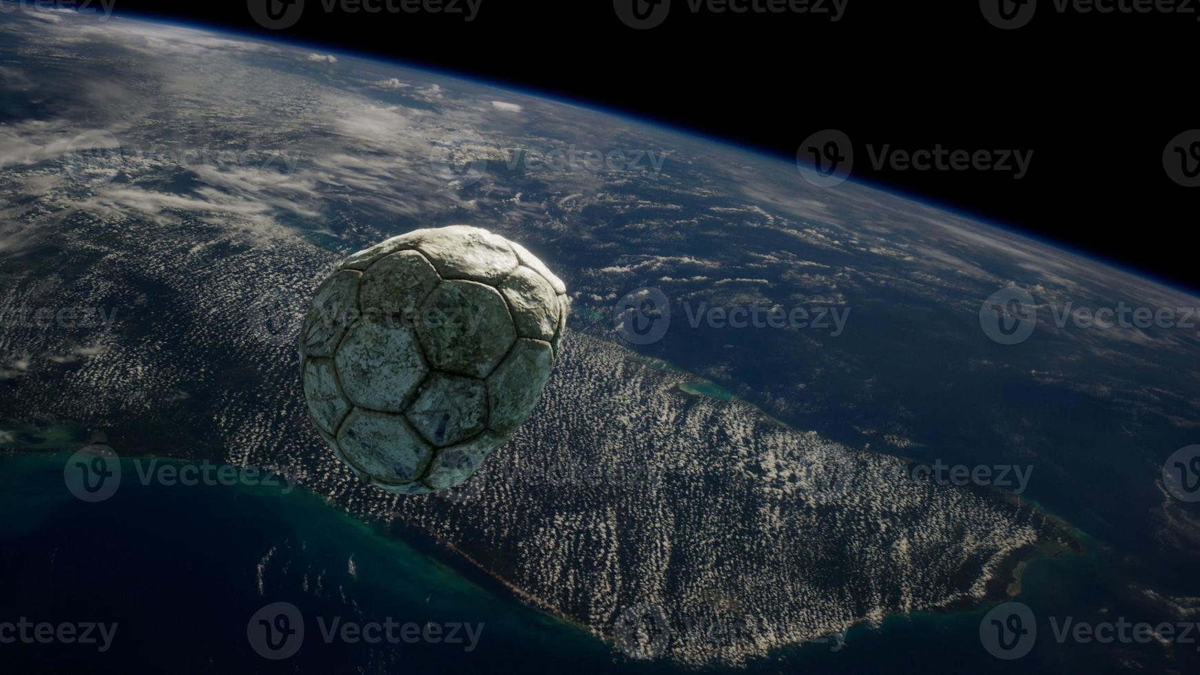 vieux ballon de football dans l'espace sur l'orbite terrestre photo