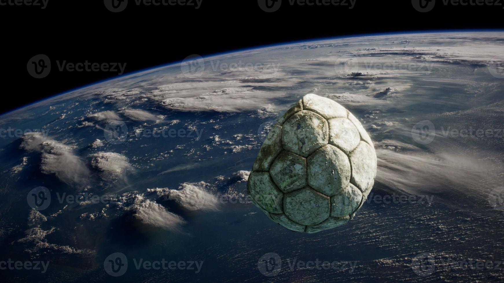 vieux ballon de football dans l'espace sur l'orbite terrestre photo