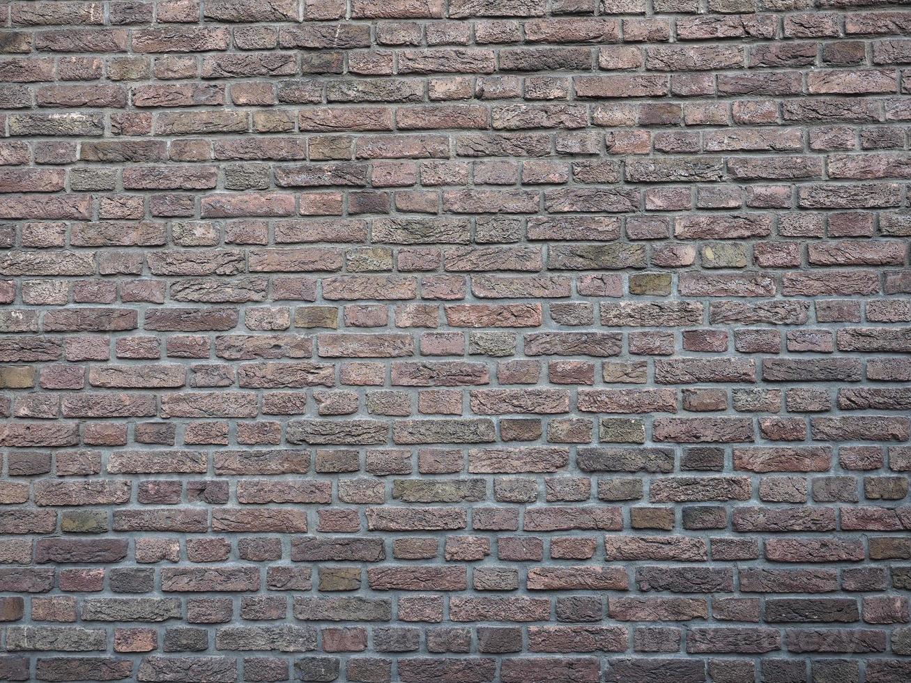 fond de mur de brique rouge foncé photo