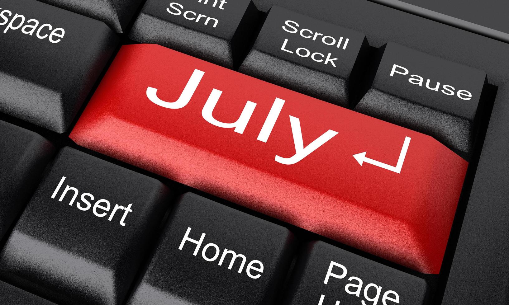 Mot de juillet sur le bouton clavier rouge photo