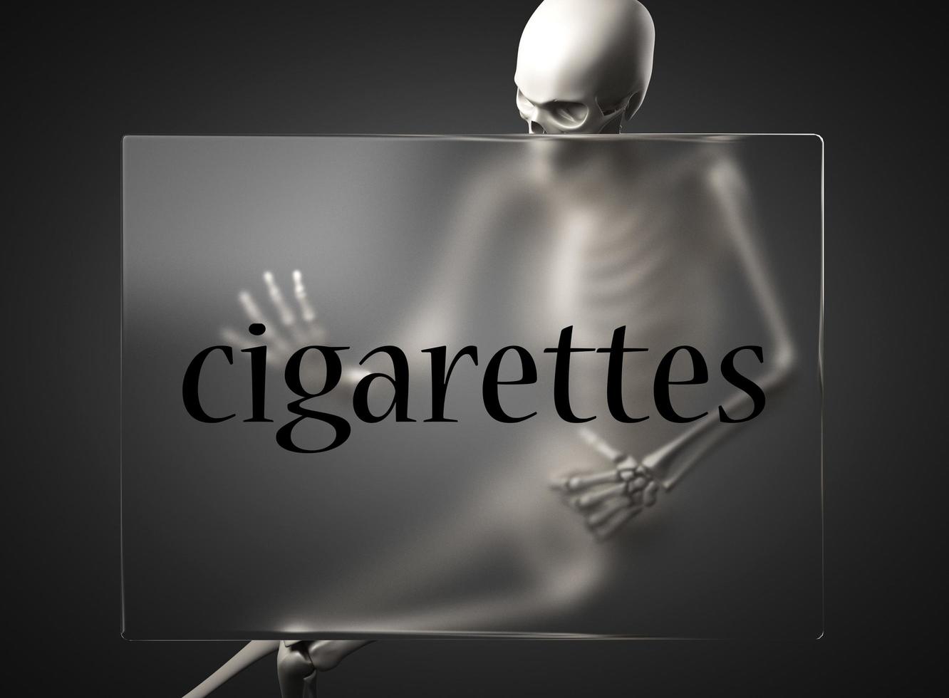 Mot de cigarettes sur verre et squelette photo