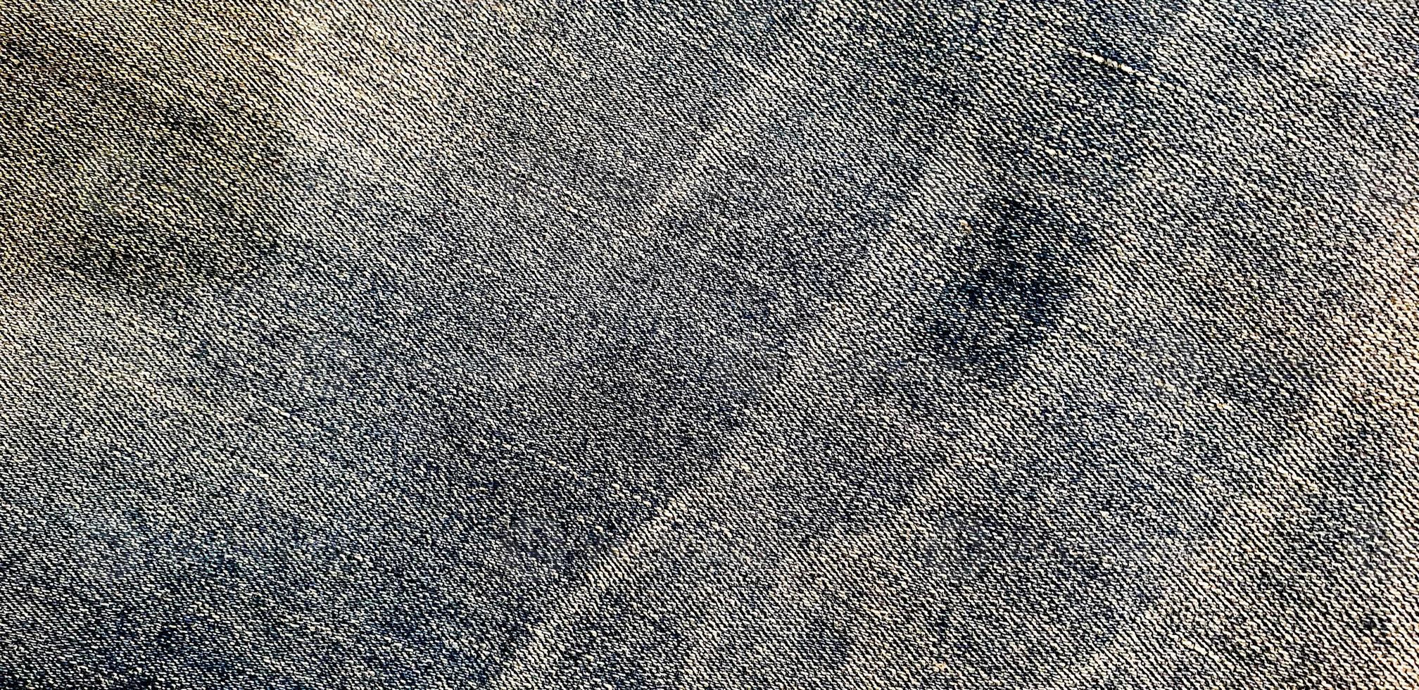 texture de tissu denim sale. vieux fond de texture de jeans bleus photo