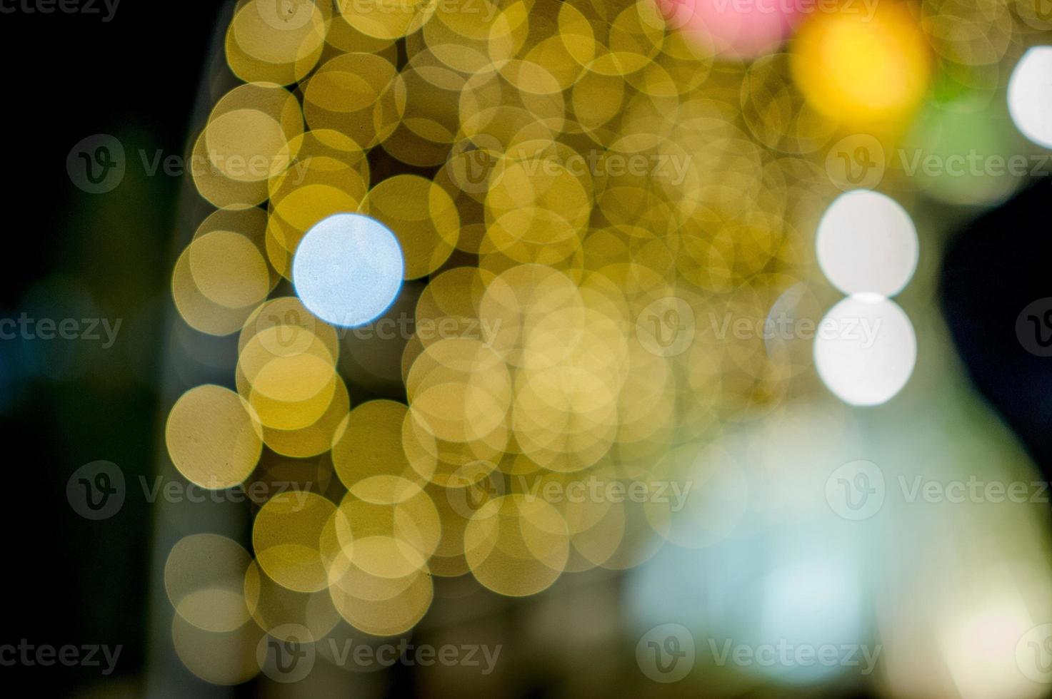 lumières colorées le jour de l'an, lumières de cercle bokeh, image d'arrière-plan avec espace de copie. photo