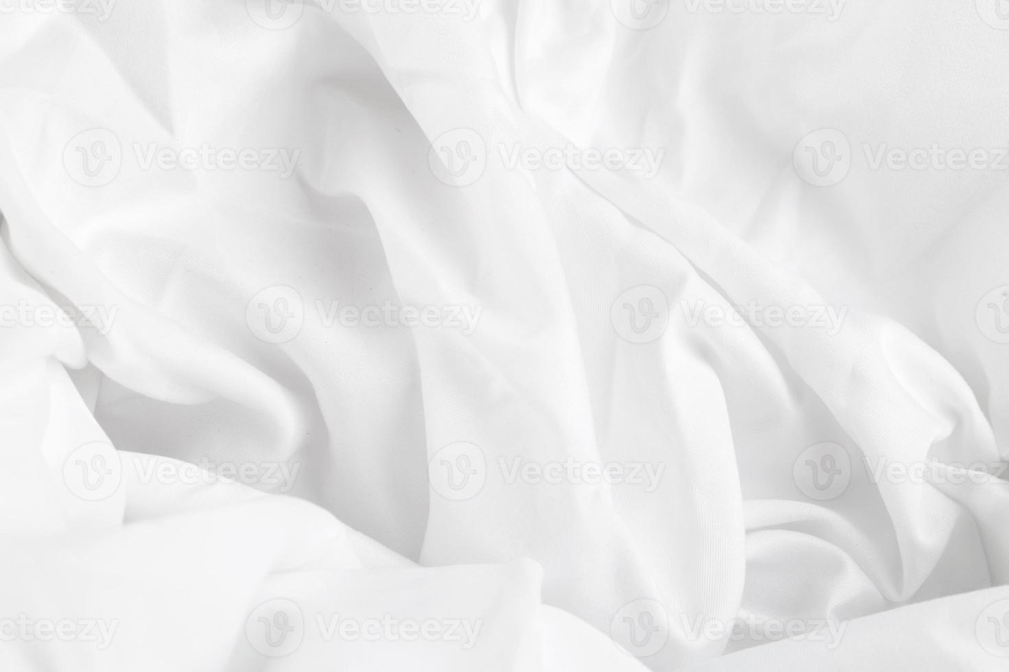 fond de texture de tissu de luxe en soie blanche ou en satin, texture de drap de lit en tissu élégant et lisse photo
