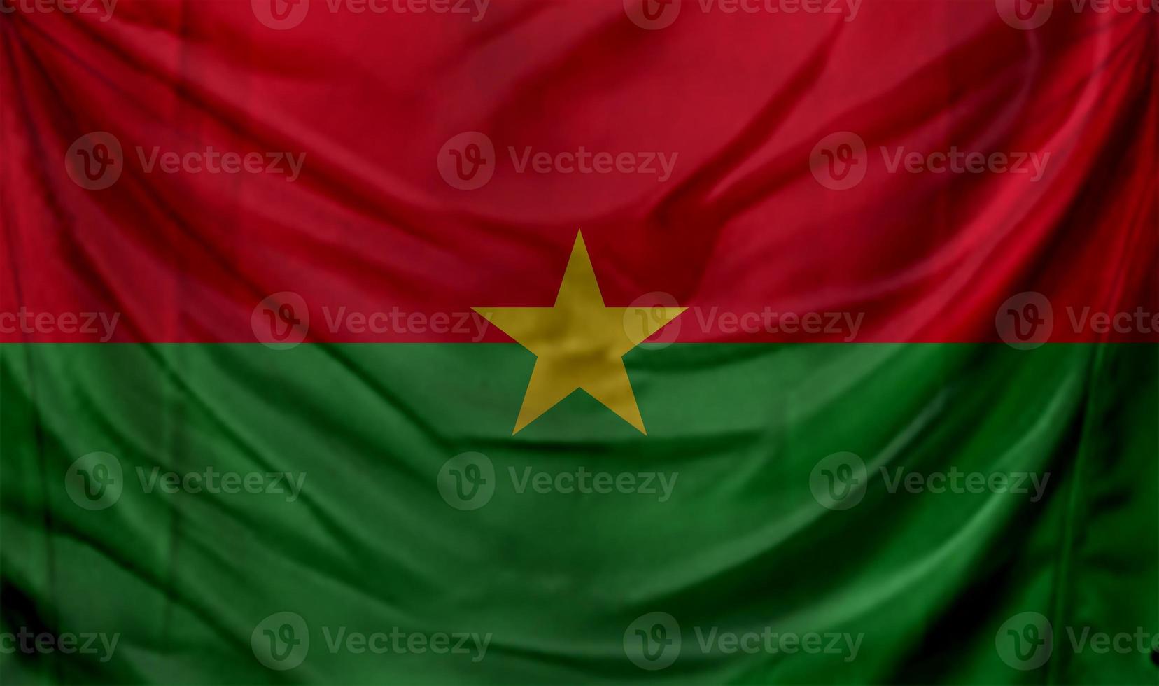 drapeau du burkina faso agitant. arrière-plan pour la conception patriotique et nationale photo