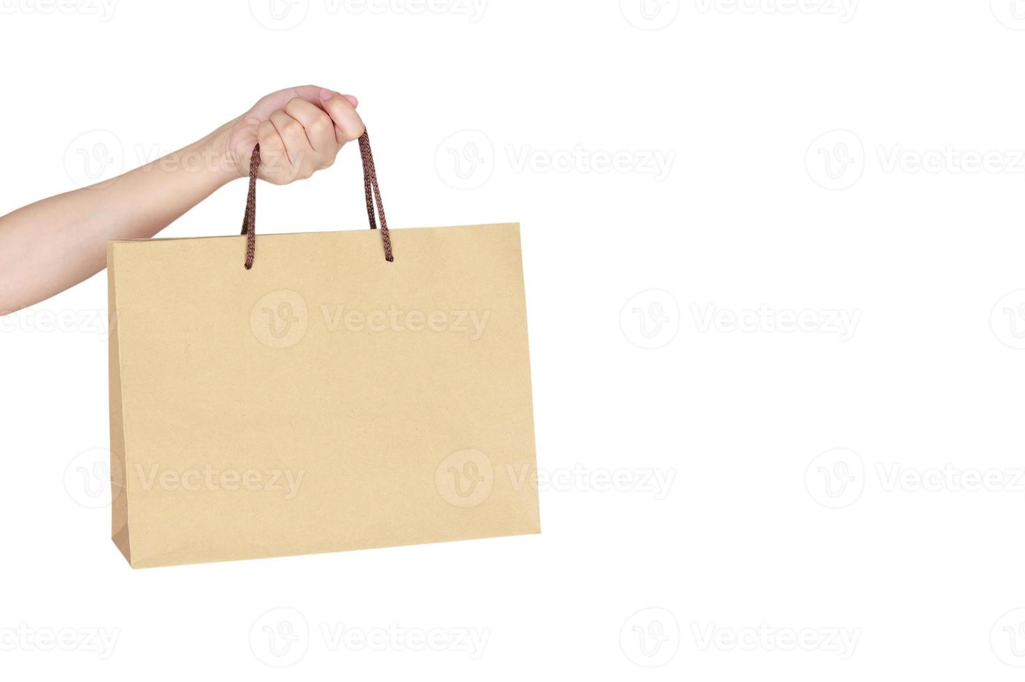 main féminine tenant un sac à provisions photo