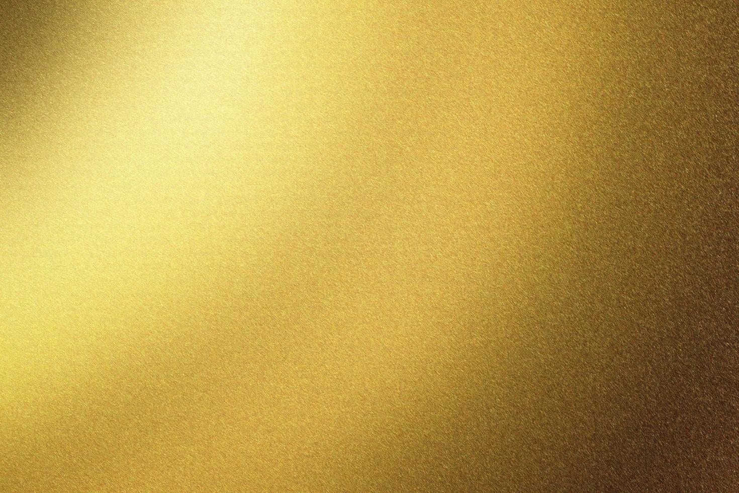 mur en acier doré brillant brossé, fond de texture abstraite photo