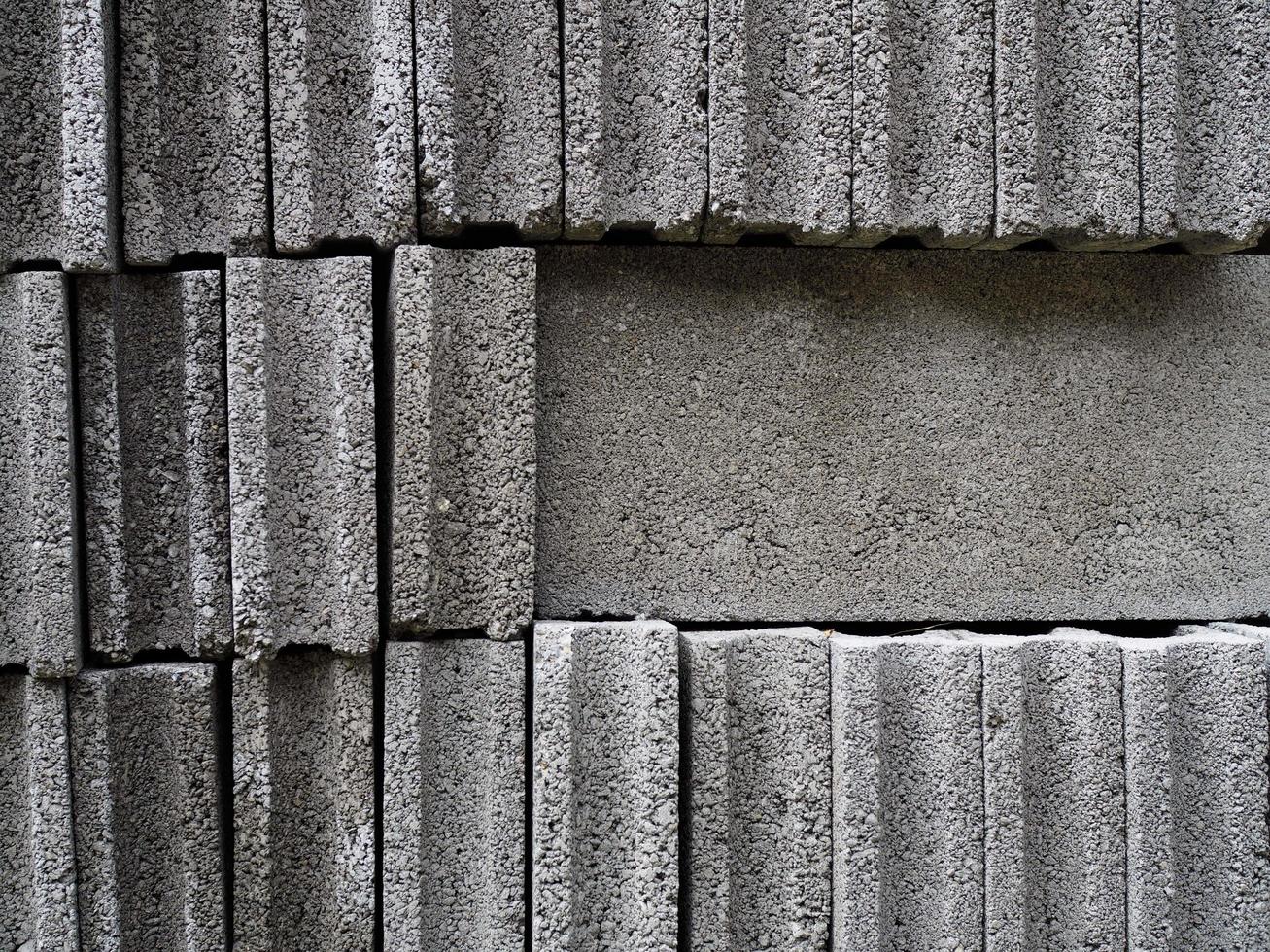 bloc de béton, brique de ciment, bloc pour la construction. photo