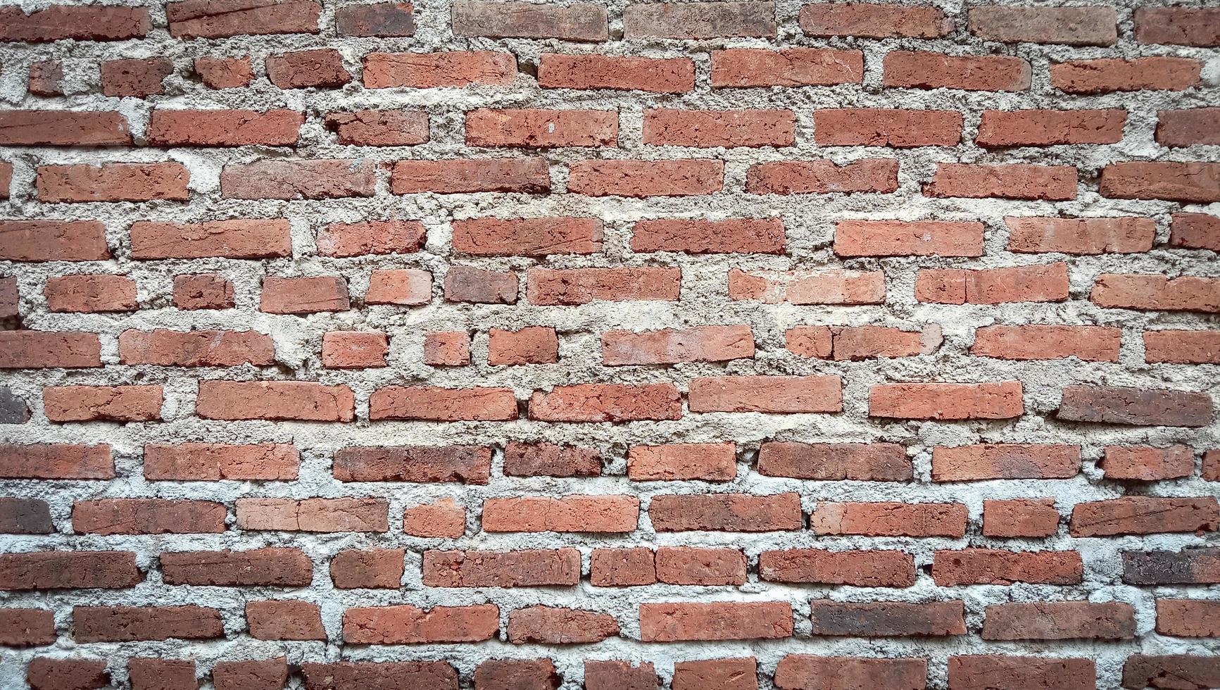 fond de texture rustique de mur de brique rouge vintage photo