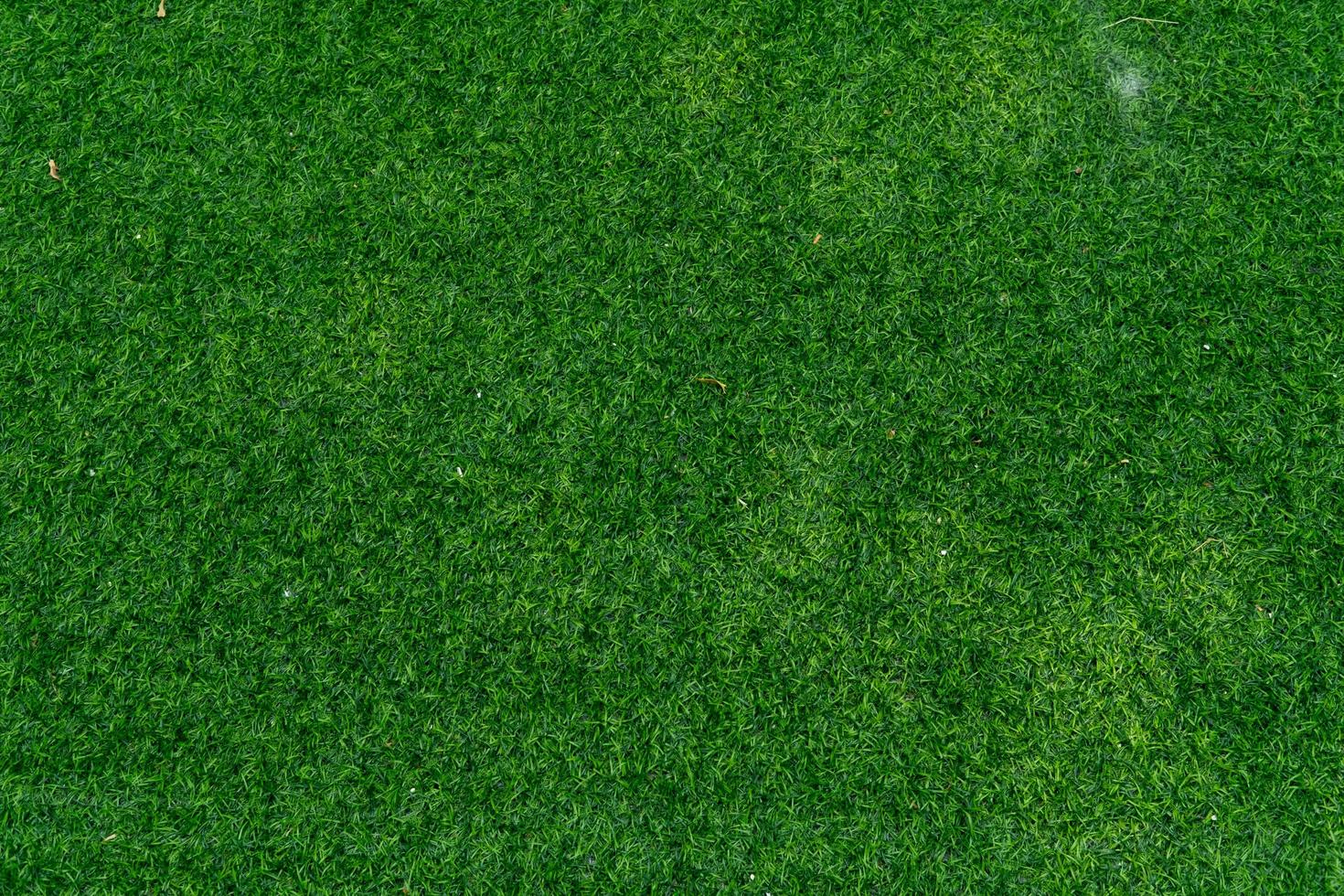 vue de dessus de la texture d'arrière-plan du champ de gazon artificiel, prise d'en haut. fond abstrait. photo