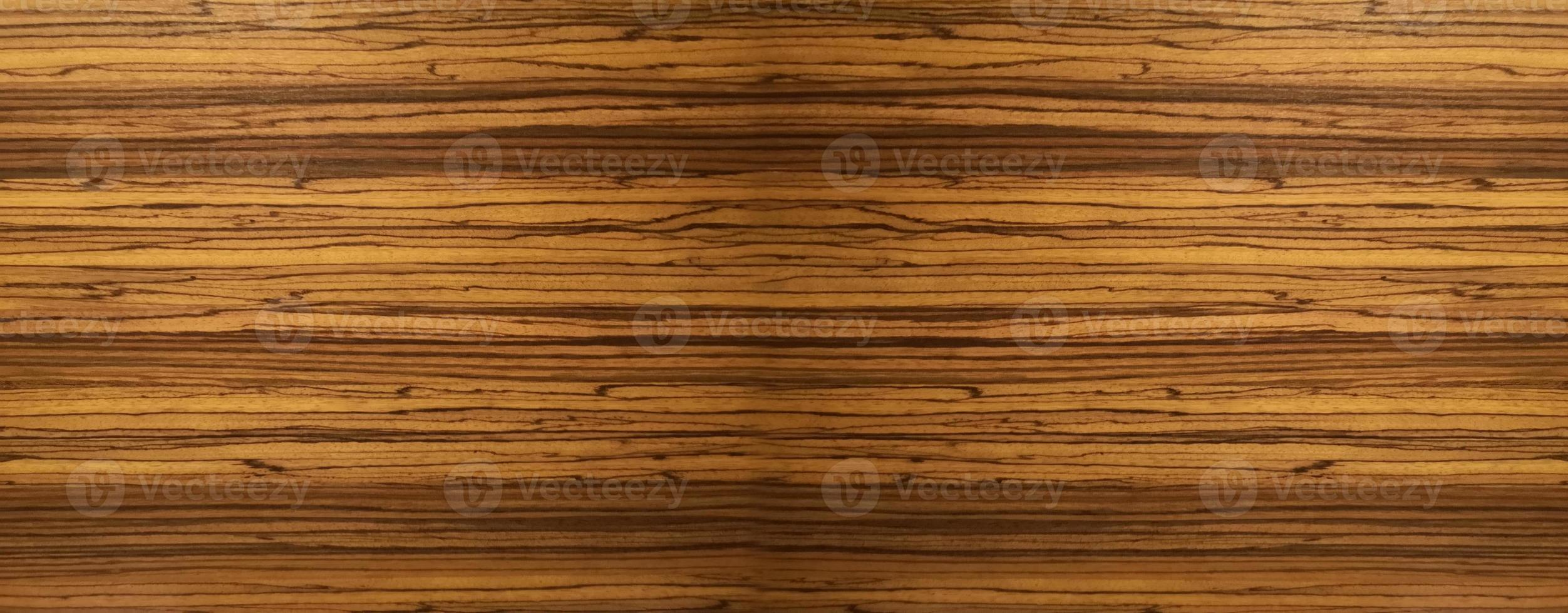 matériau de mur en bois de couleur marron foncé texture de surface de bavure sur fond noir motif abstrait en bois, scène de vue de dessus photo