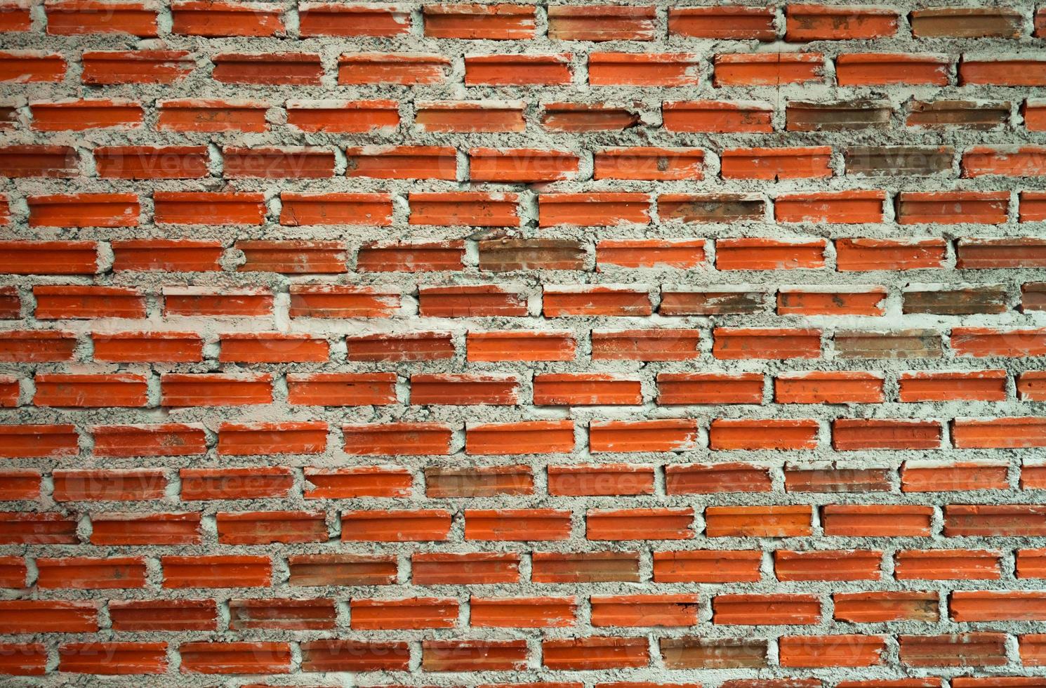 fond de texture de mur de brique rouge et orange. maçonnerie pour l'intérieur de l'architecture de la maison. conception de loft de maison. fond vintage de mur de briques. travaux de maçonnerie. construction de maison. modèle de mur de briques. photo