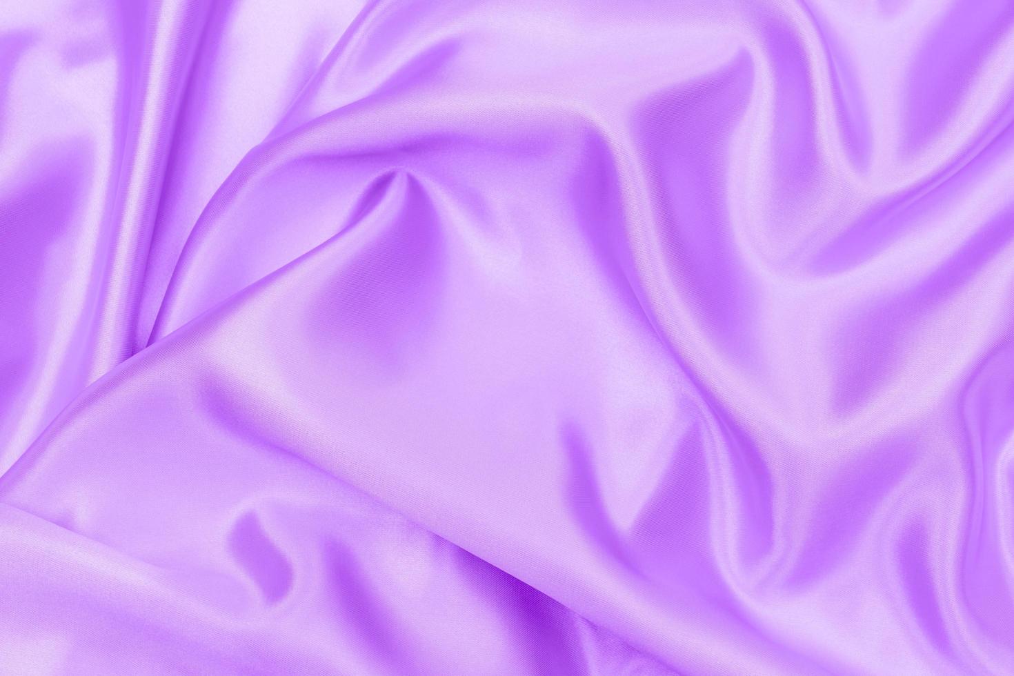 texture de tissu satiné violet proton arrière-plan flou doux photo