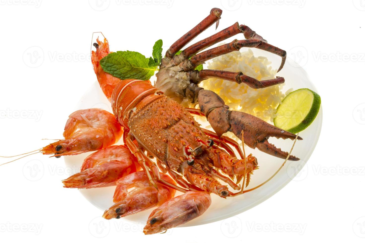 langouste, crevettes, pattes de crabe et riz photo