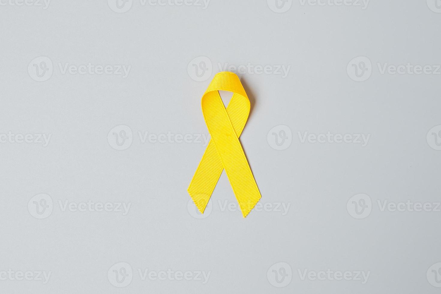 prévention du suicide, sarcome, os, vessie, mois de sensibilisation au cancer infantile, ruban jaune pour soutenir les personnes vivant et malades. santé des enfants et concept de la journée mondiale du cancer photo