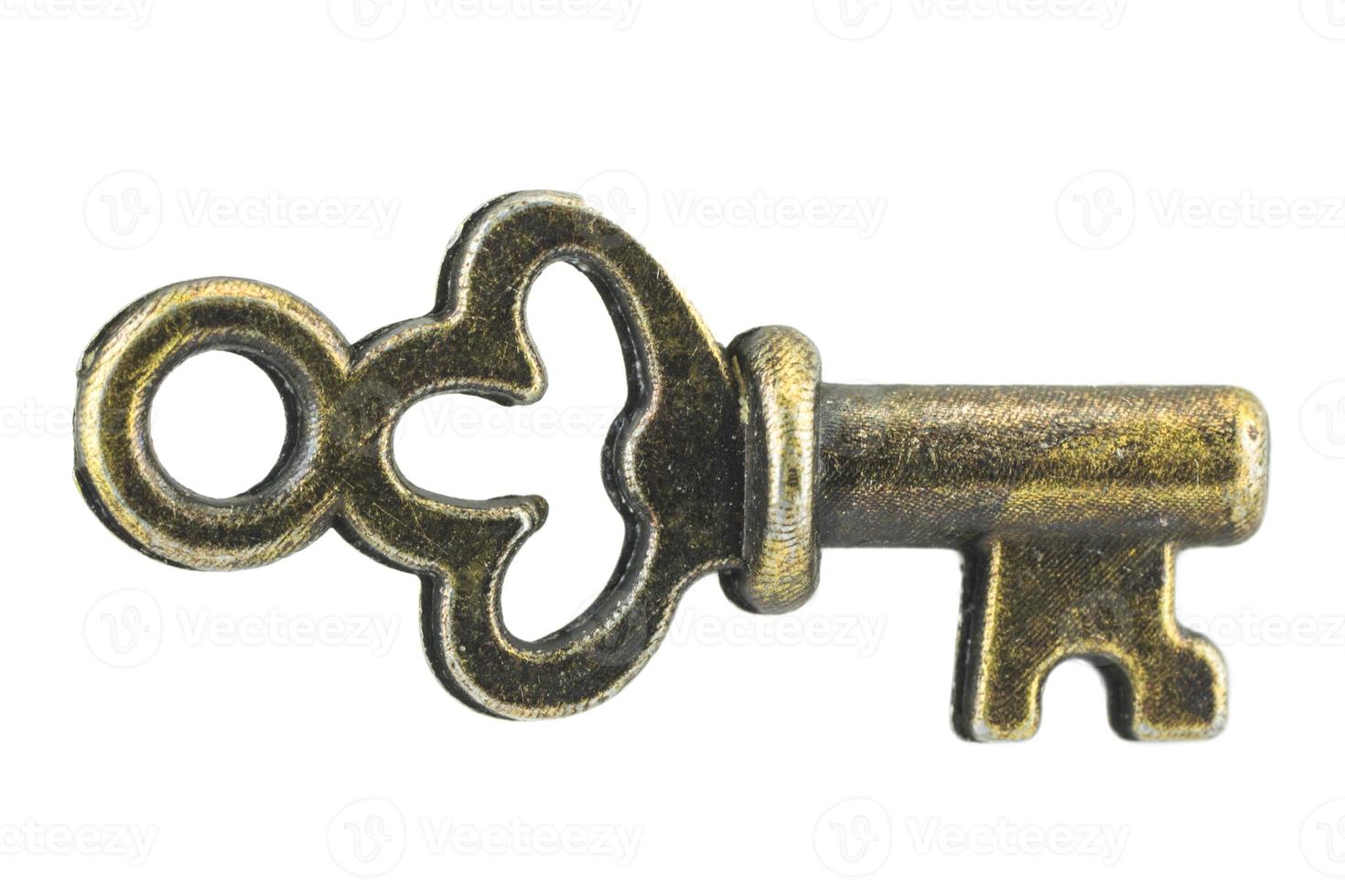clé vintage clé dorée antique sur fond blanc chemin de détourage photo