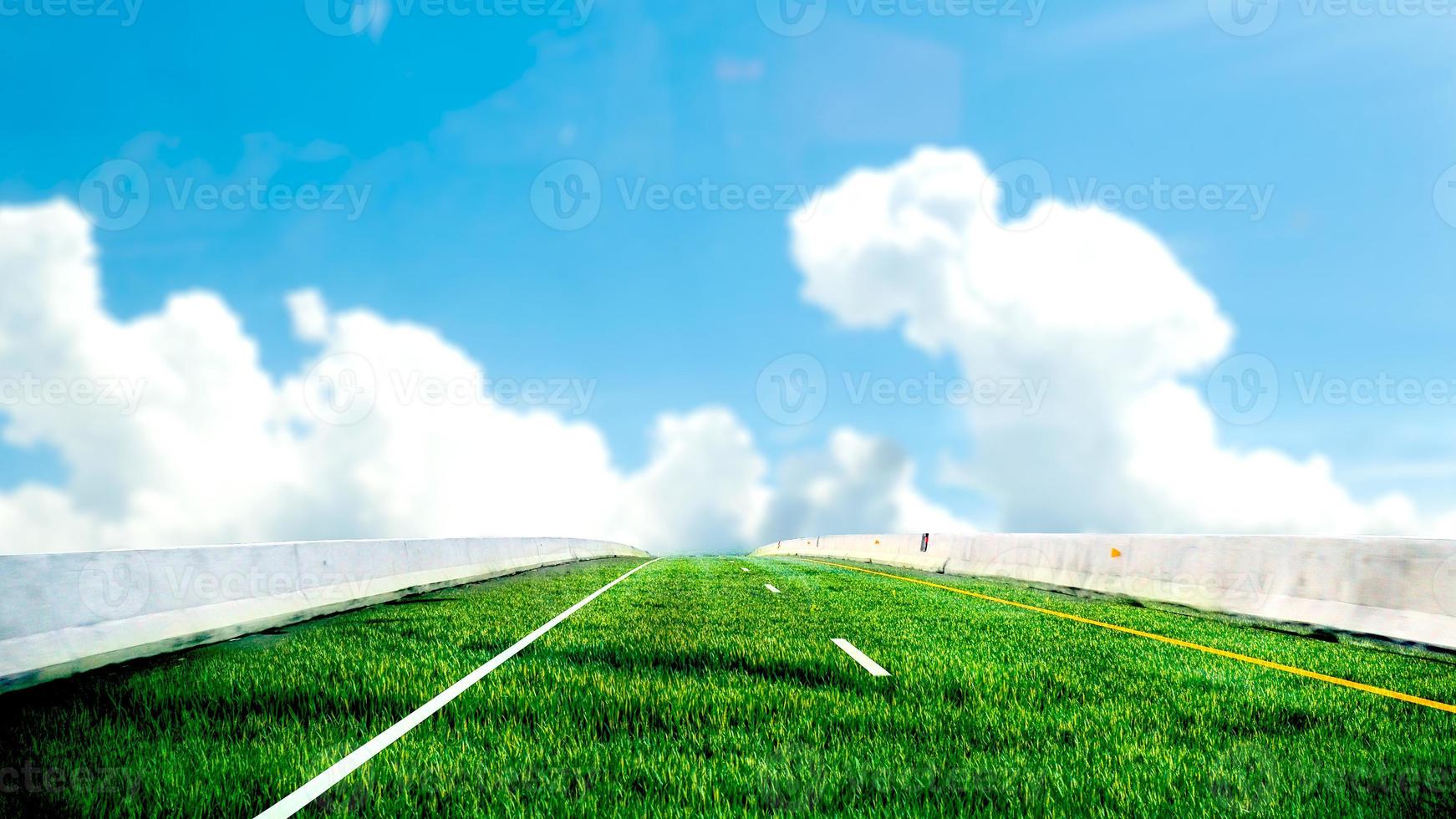 concept de route verte sans pollution. la route est faite d'herbe par une belle journée. photo