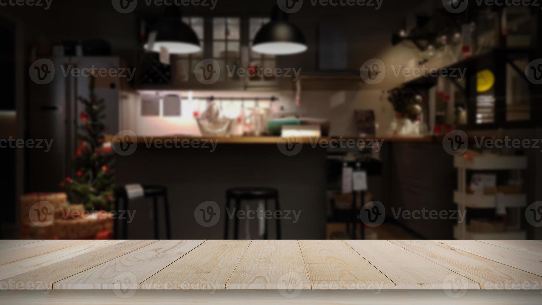 cuisine de luxe moderne ton doré noir avec espace de table en bois photo