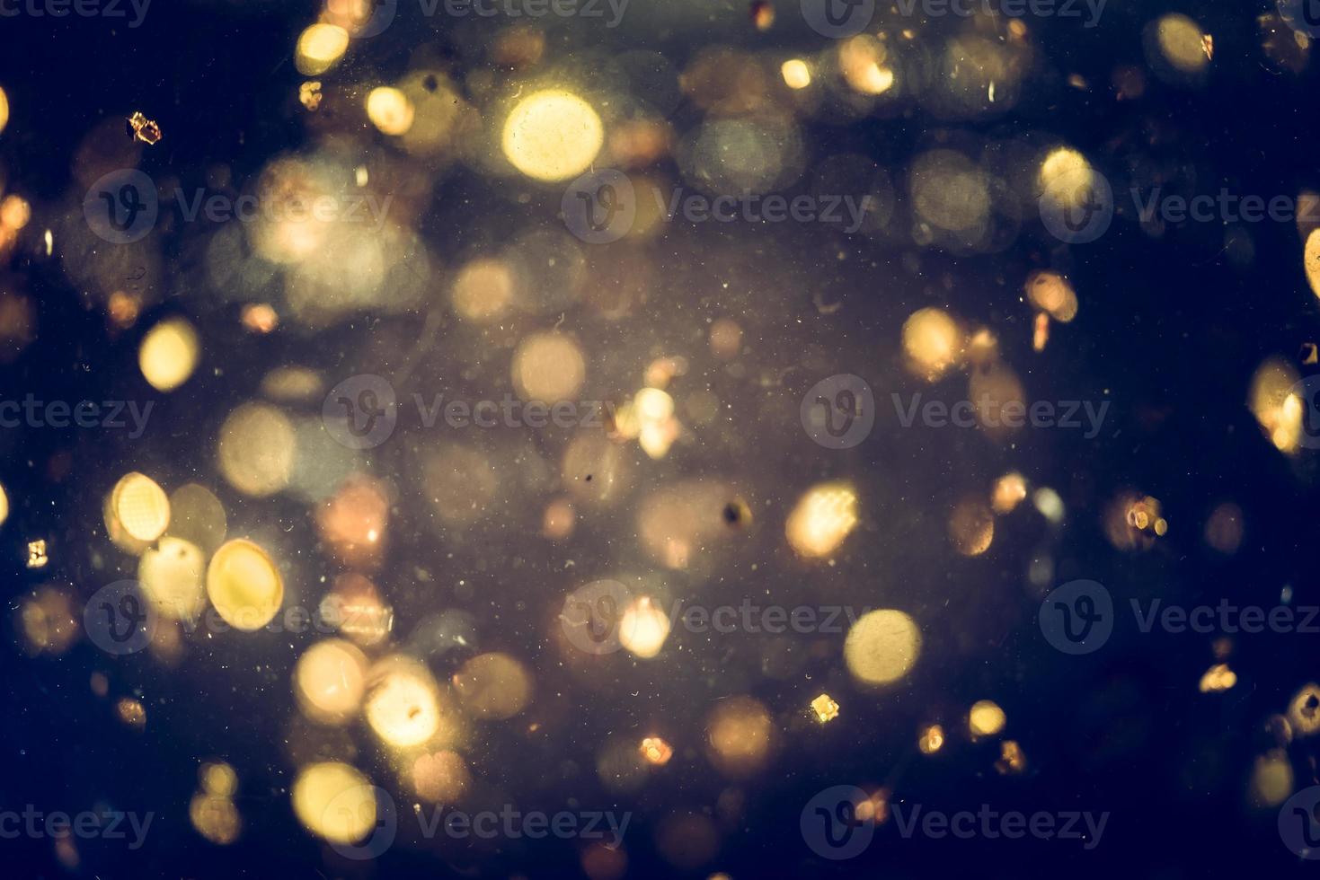 texture d'éclairage bokeh de paillettes dorées fond abstrait flou pour l'anniversaire, l'anniversaire, le mariage, le réveillon du nouvel an ou noël photo