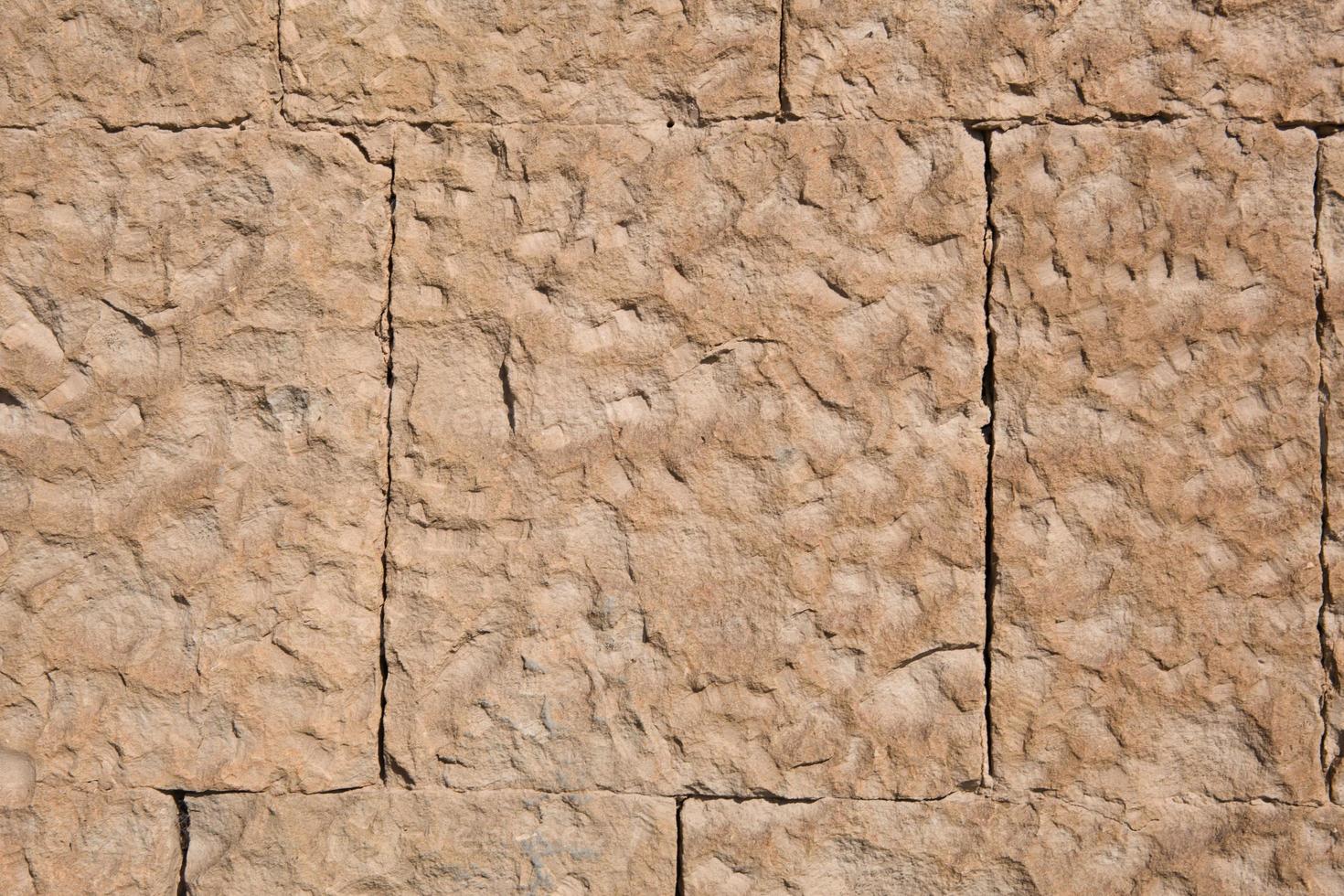 murs en maçonnerie de couleur sable naturel. gros plan de texture de pierre, fond de construction et d'exploitation minière. photo