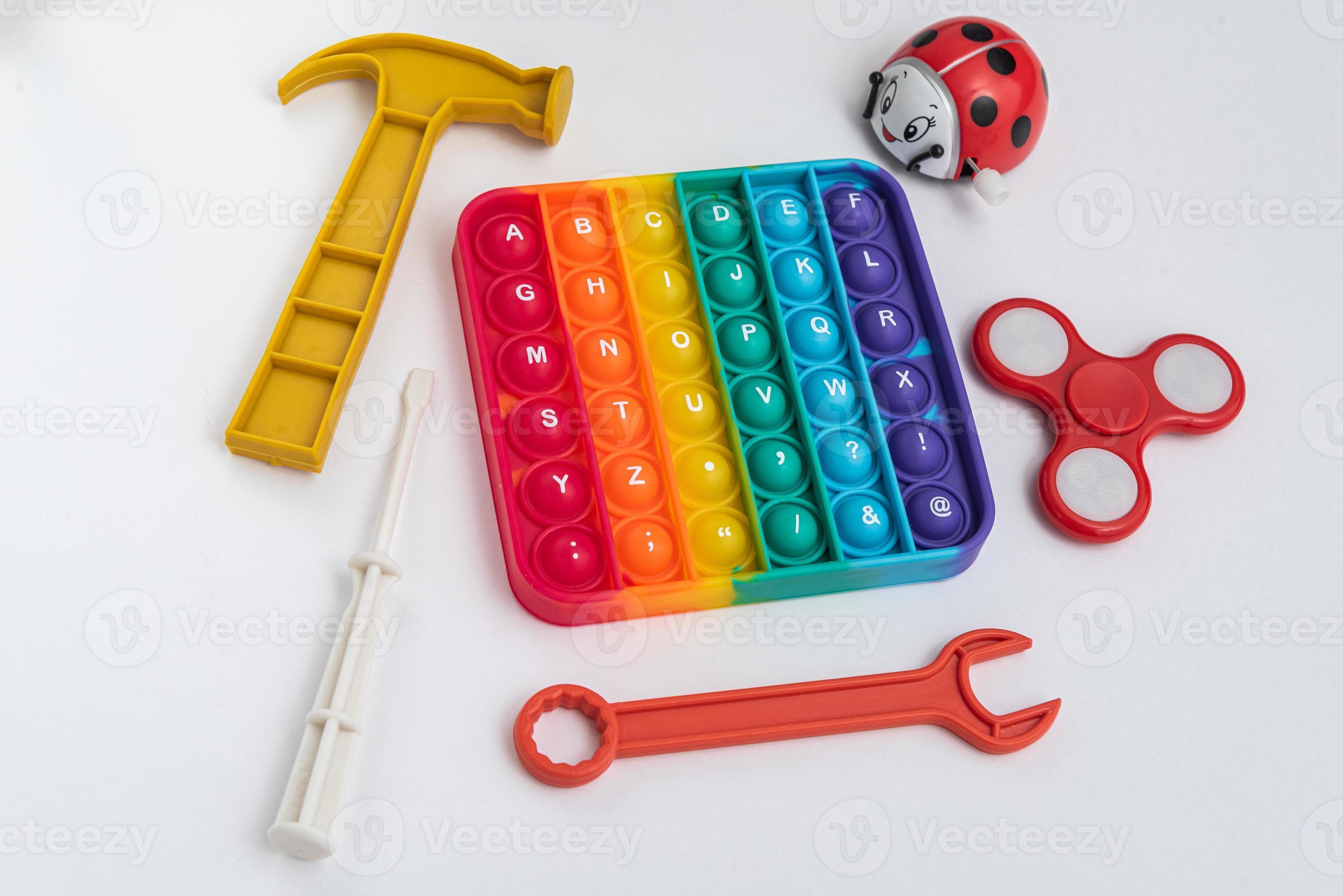 fidget pop it toy couleur arc-en-ciel - antistress, amusant et éducatif - avec quelques jouets photo