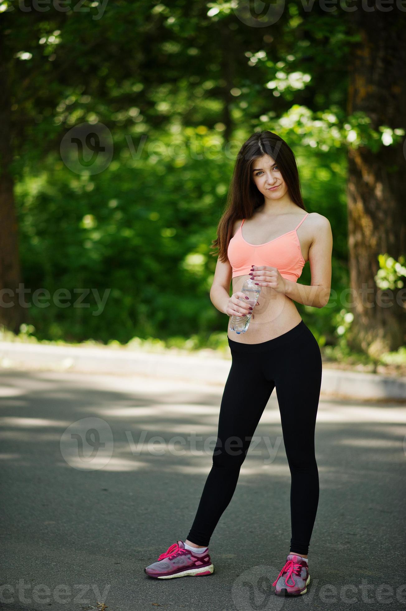 Fitness slim sexy sport girl in sportswear posed in road at park, outdoor  sports, urban style. 7219070 Stock Photo at Vecteezy