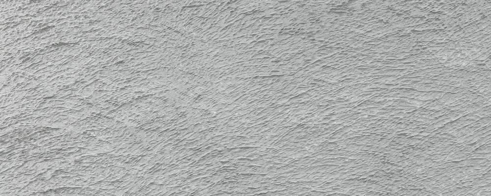 gros plan de mousse sèche sur un mur de fissures en ciment blanc