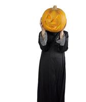 enfant dans une tenue de sorcier tenant jack o lantern comme son visage photo