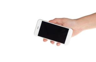 main tenant un téléphone intelligent mobile avec écran blanc sur fond blanc photo