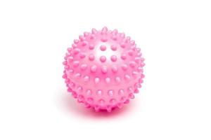 Balle de massage hérissée rose sur fond blanc photo