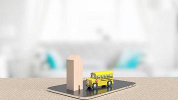 le bus scolaire et la maison en bois sur tablette pour le rendu 3d du concept d'éducation photo