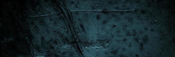 fond panoramique de texture de béton noir et gris. murs sombres effrayants, texture de ciment en béton noir légèrement clair pour le fond. surface sombre grunge paysage panoramique photo