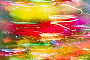 bokeh multicolore lumineux en mouvement flou d'arrière-plan photo